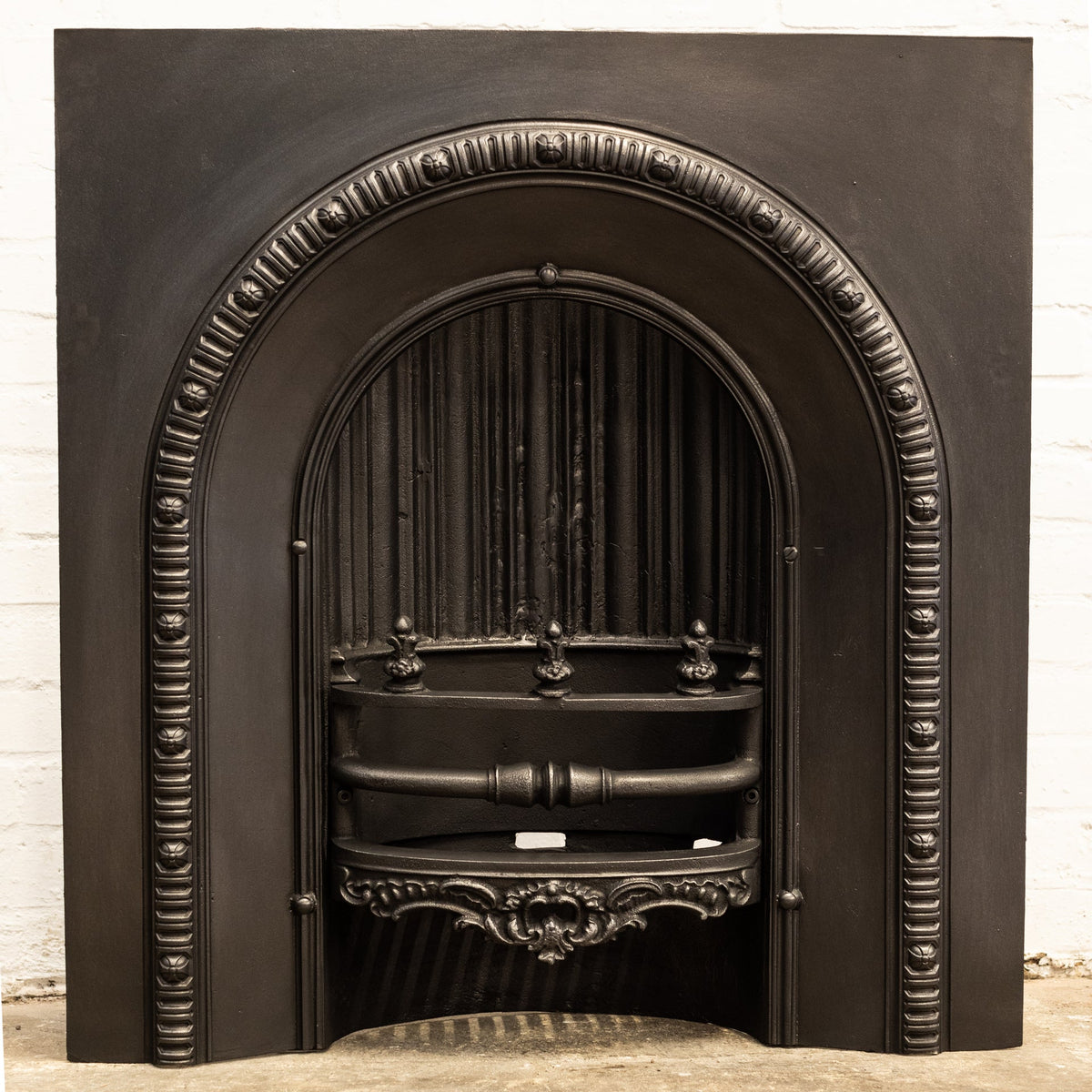 Antique Cast Iron Arched Fireplace Insert With Finials | The Architectural Forum