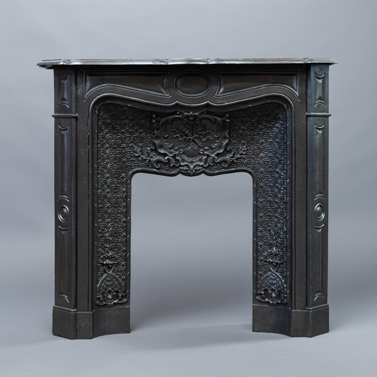 Rare Highly Ornate Antique Cast Iron Fireplace Surround | Pair Available