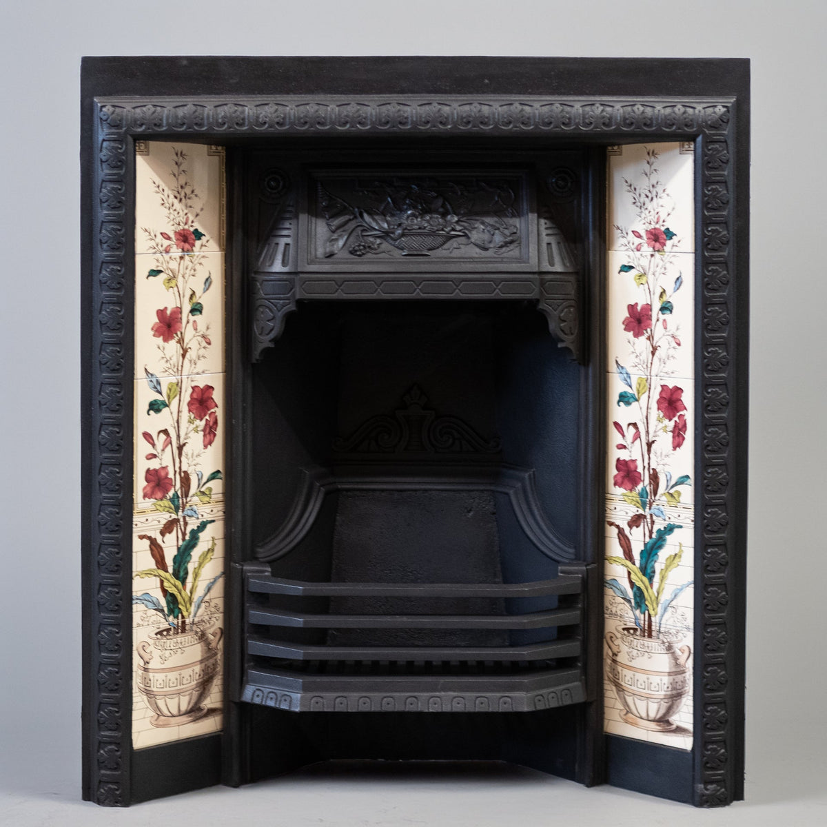 Antique Victorian Cast Iron Fireplace with Decorative Floral Tiles | The Architectural Forum