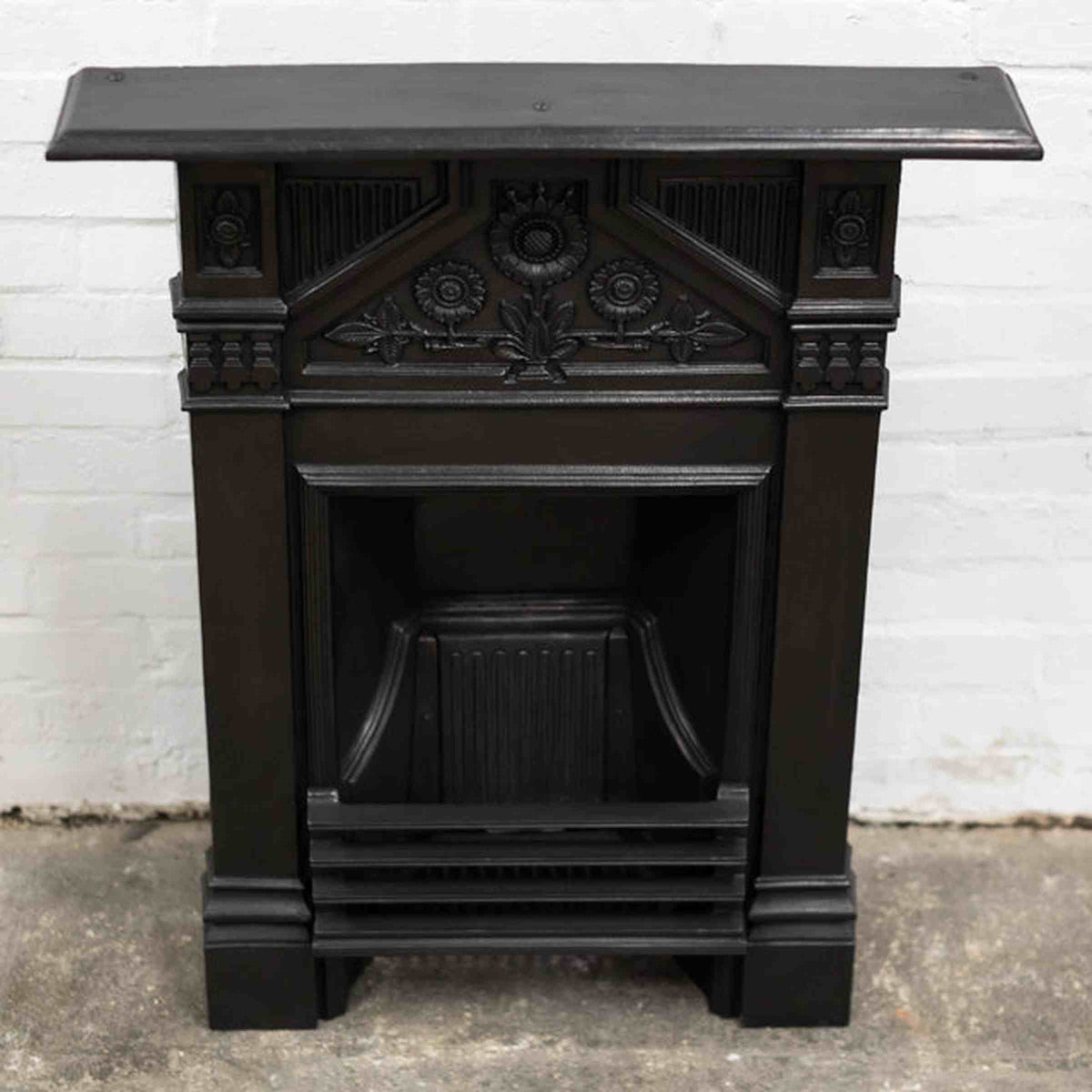 Antique Iron Combination Fireplace With Sunflowers | The Architectural Forum