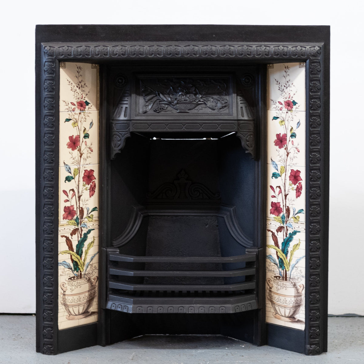 Antique Victorian Cast Iron Fireplace with Decorative Floral Tiles | The Architectural Forum