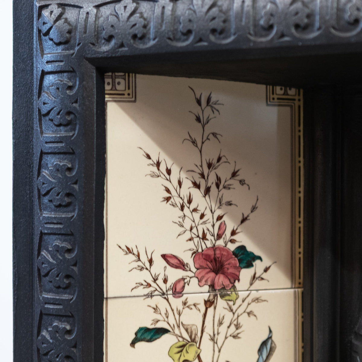 Antique Victorian Cast Iron Fireplace with Decorative Floral Tiles | The Architectural Forum
