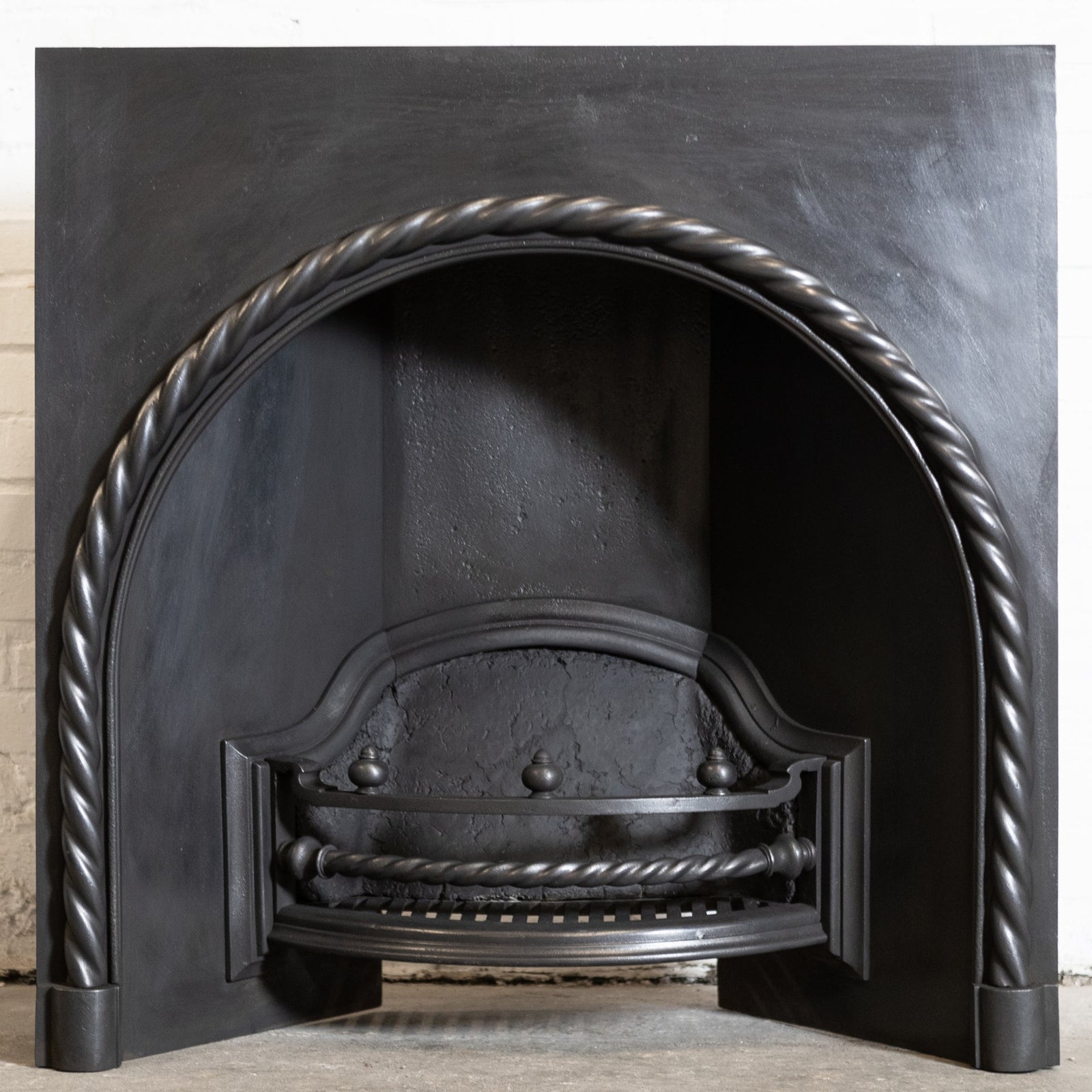 Antique Cast Iron Arched Fireplace Insert with Rope Detail | The Architectural Forum