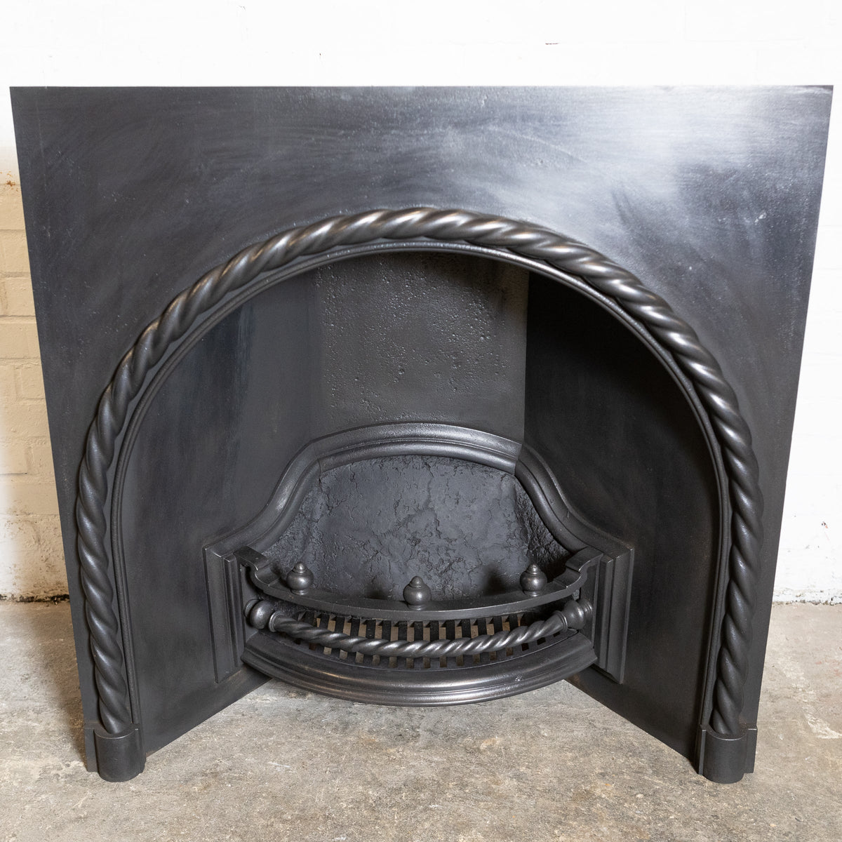 Antique Cast Iron Arched Fireplace Insert with Rope Detail | The Architectural Forum