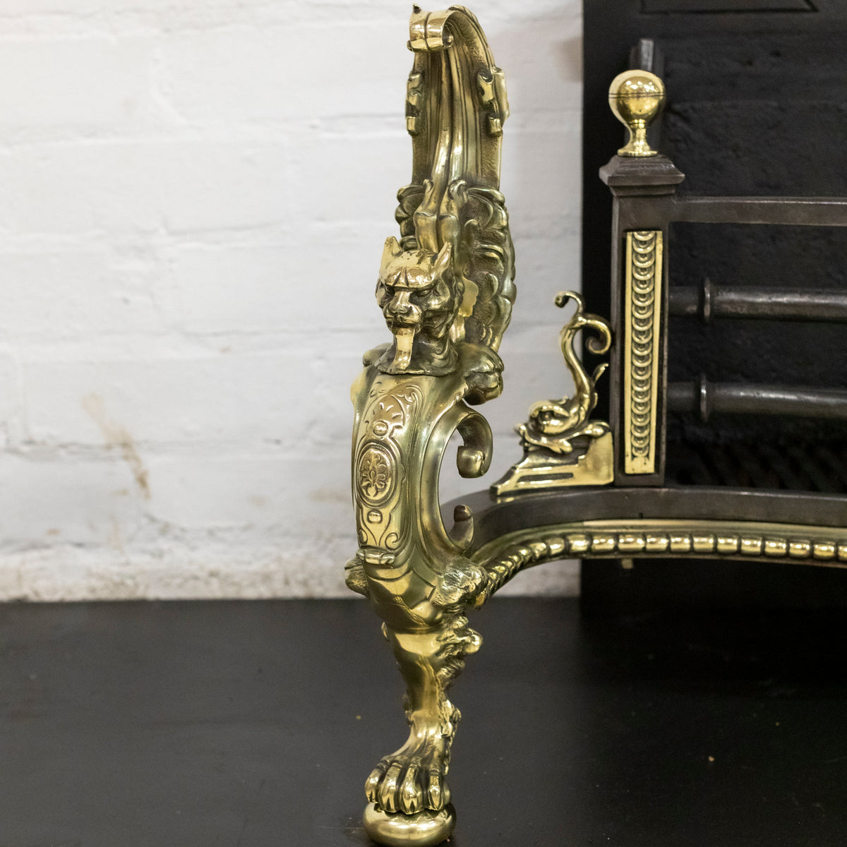 Antique Rococo Style Polished Steel and Brass Fire Basket with Griffins | The Architectural Forum