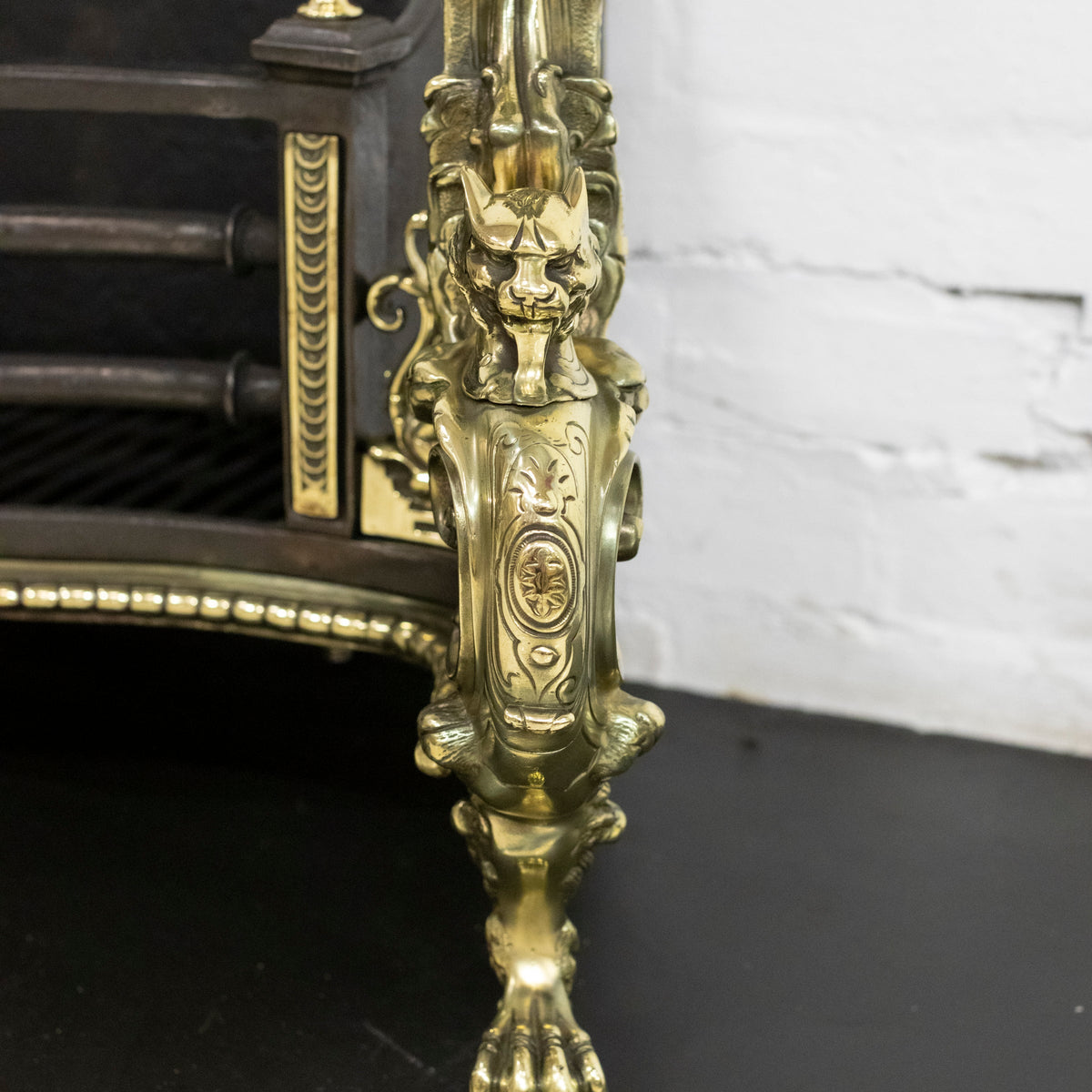 Antique Rococo Style Polished Steel and Brass Fire Basket with Griffins | The Architectural Forum