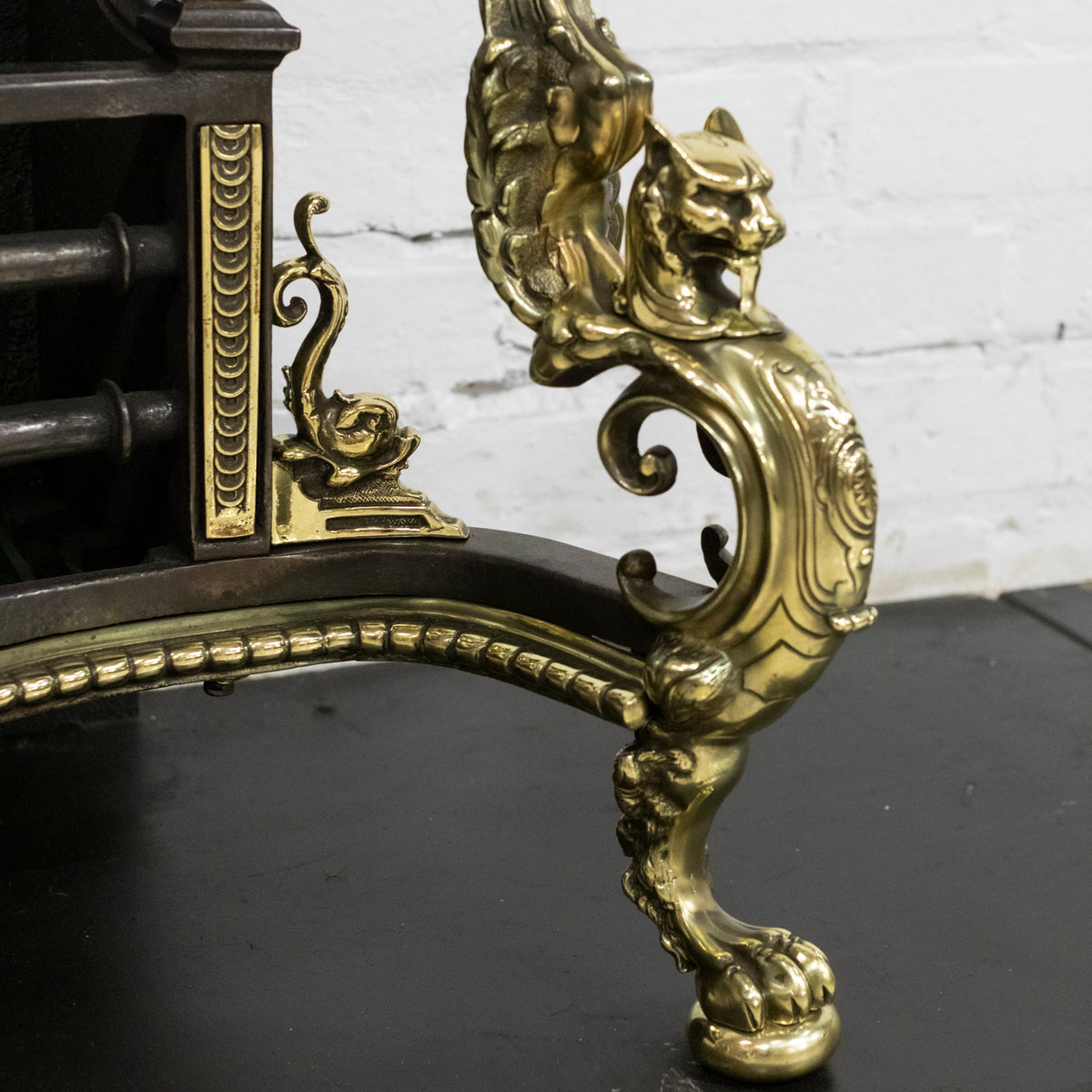 Antique Rococo Style Polished Steel and Brass Fire Basket with Griffins | The Architectural Forum