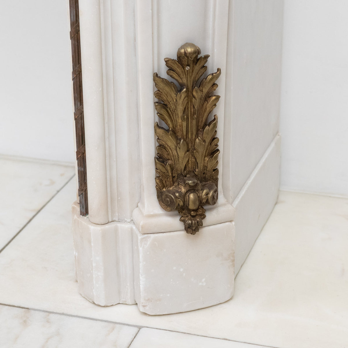 Antique French Louis XV Style Statuary Marble Fireplace with Brass Mounts | The Architectural Forum