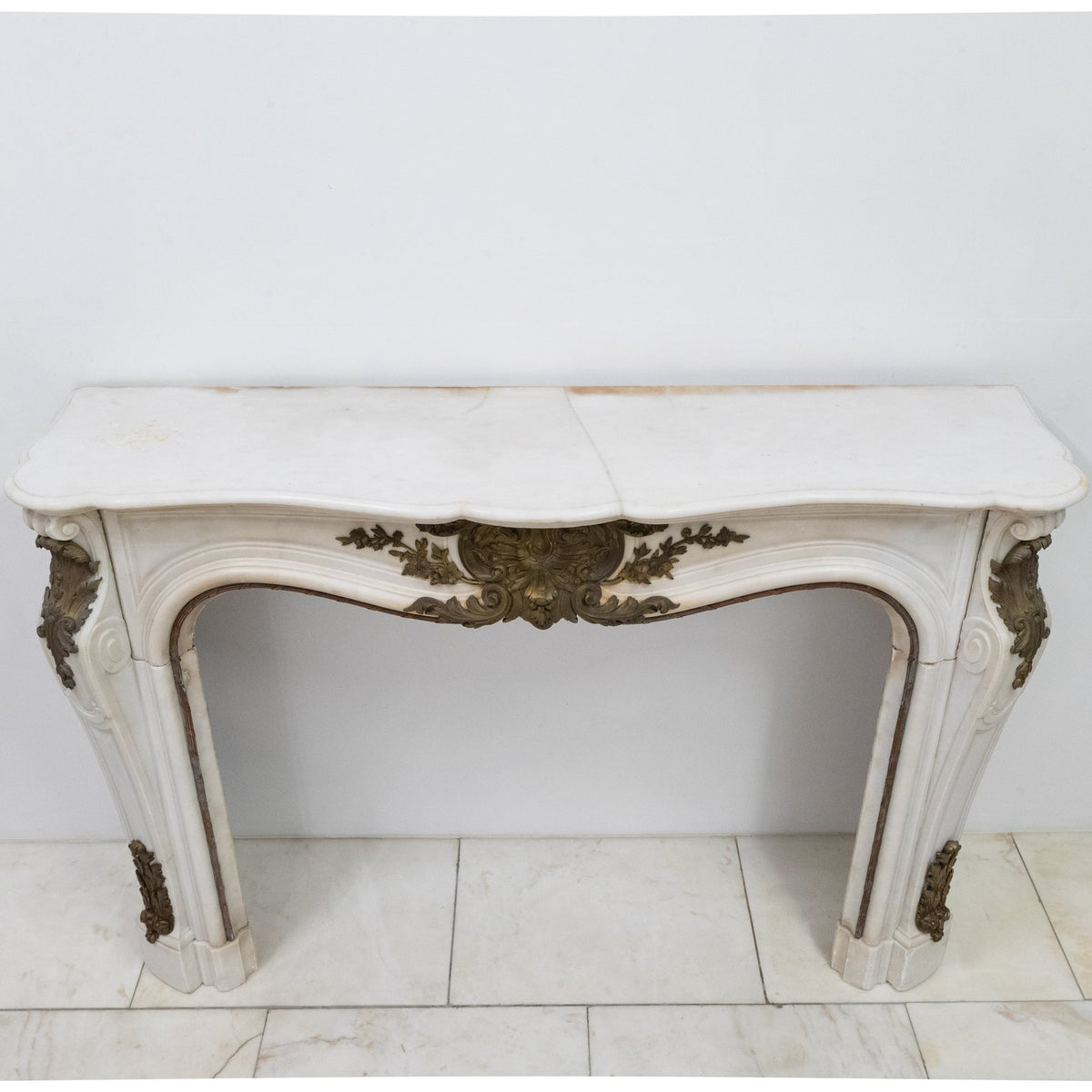 Antique French Louis XV Style Statuary Marble Fireplace with Brass Mounts | The Architectural Forum