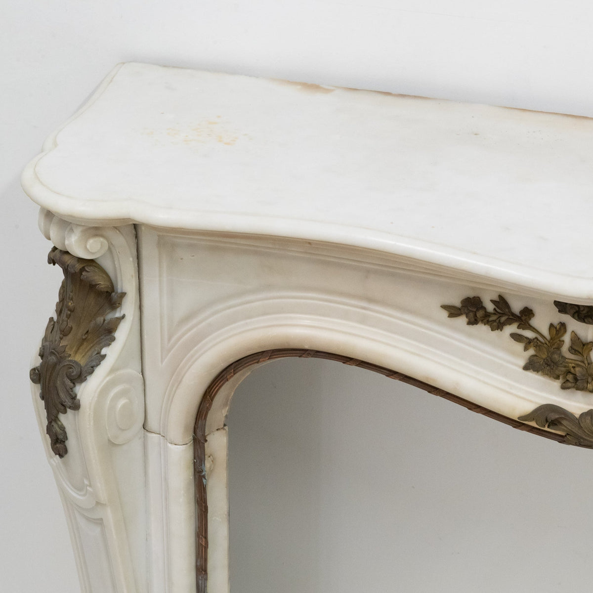 Antique French Louis XV Style Statuary Marble Fireplace with Brass Mounts | The Architectural Forum