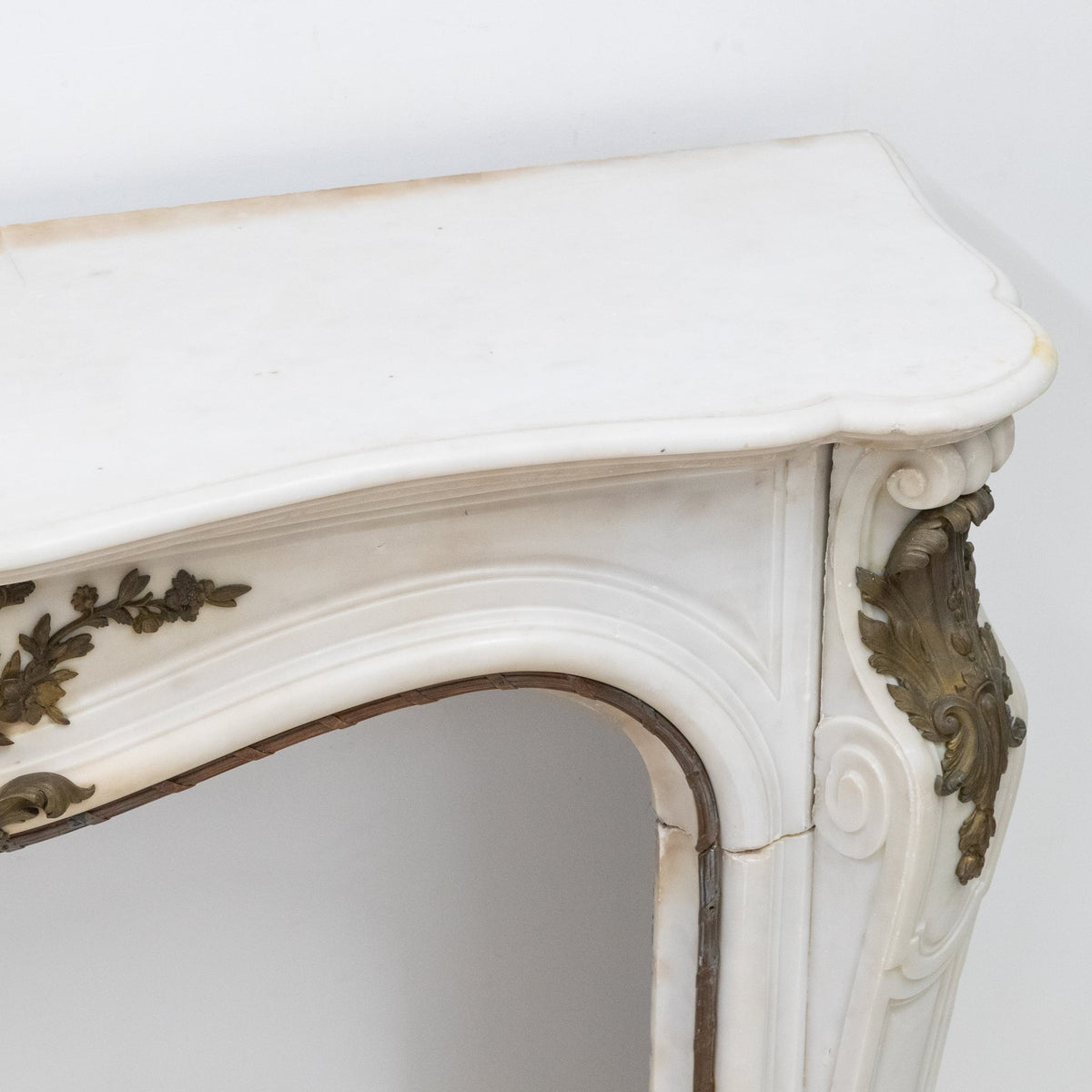 Antique French Louis XV Style Statuary Marble Fireplace with Brass Mounts | The Architectural Forum