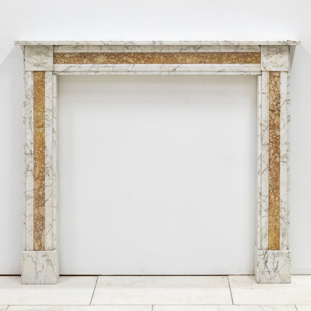 Regency Carrara Marble Fireplace Surround with Siena Inlay | The Architectural Forum