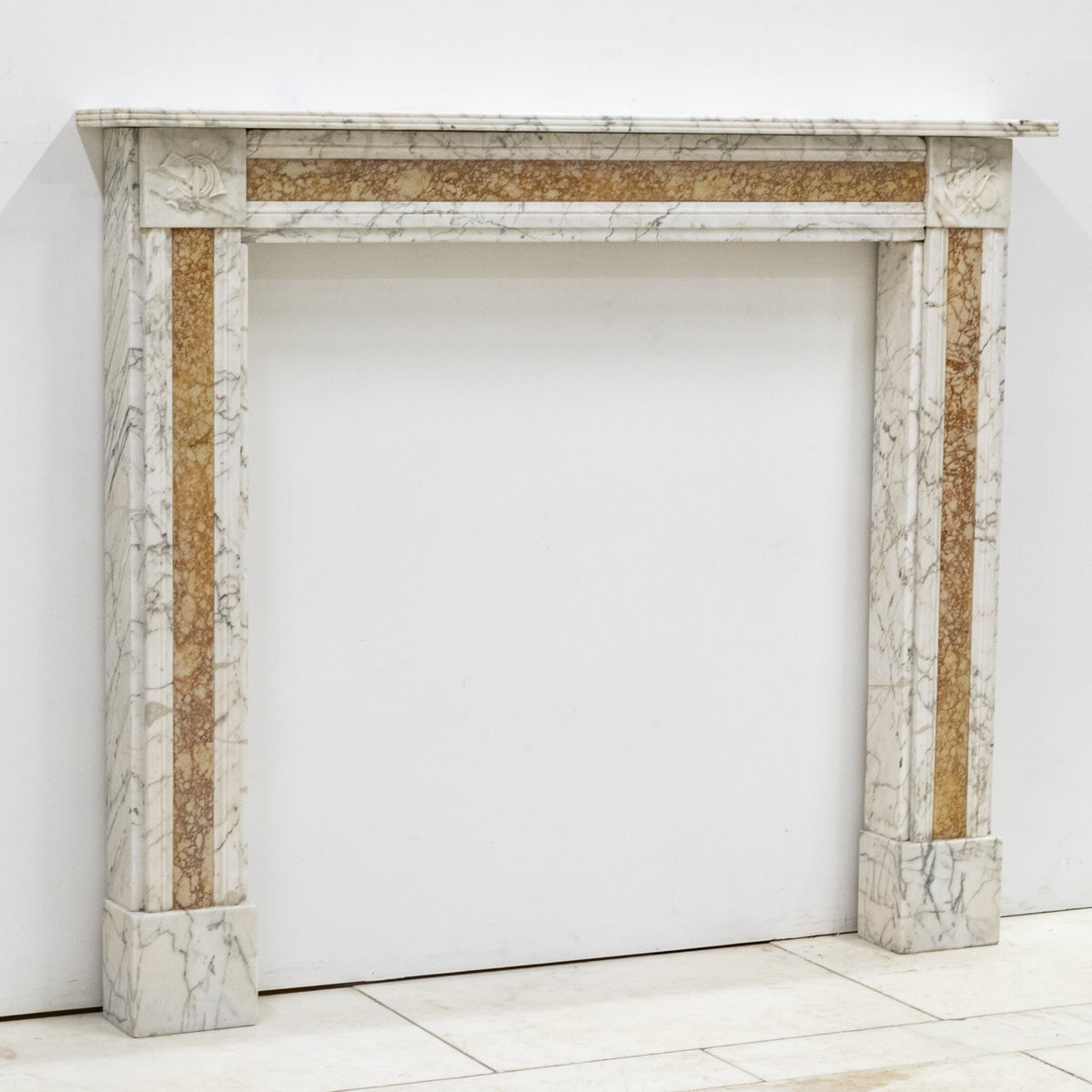 Regency Carrara Marble Fireplace Surround with Siena Inlay | The Architectural Forum
