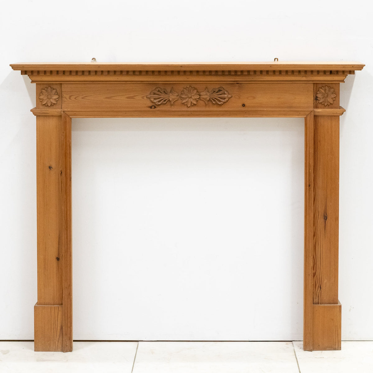 Antique Wooden Fireplace Surround with Flowers | The Architectural Forum