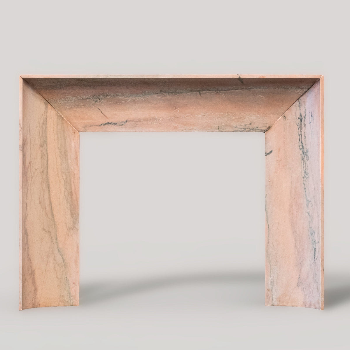 Bolection Fireplace Surround in Reclaimed Pink Marble | The Architectural Forum