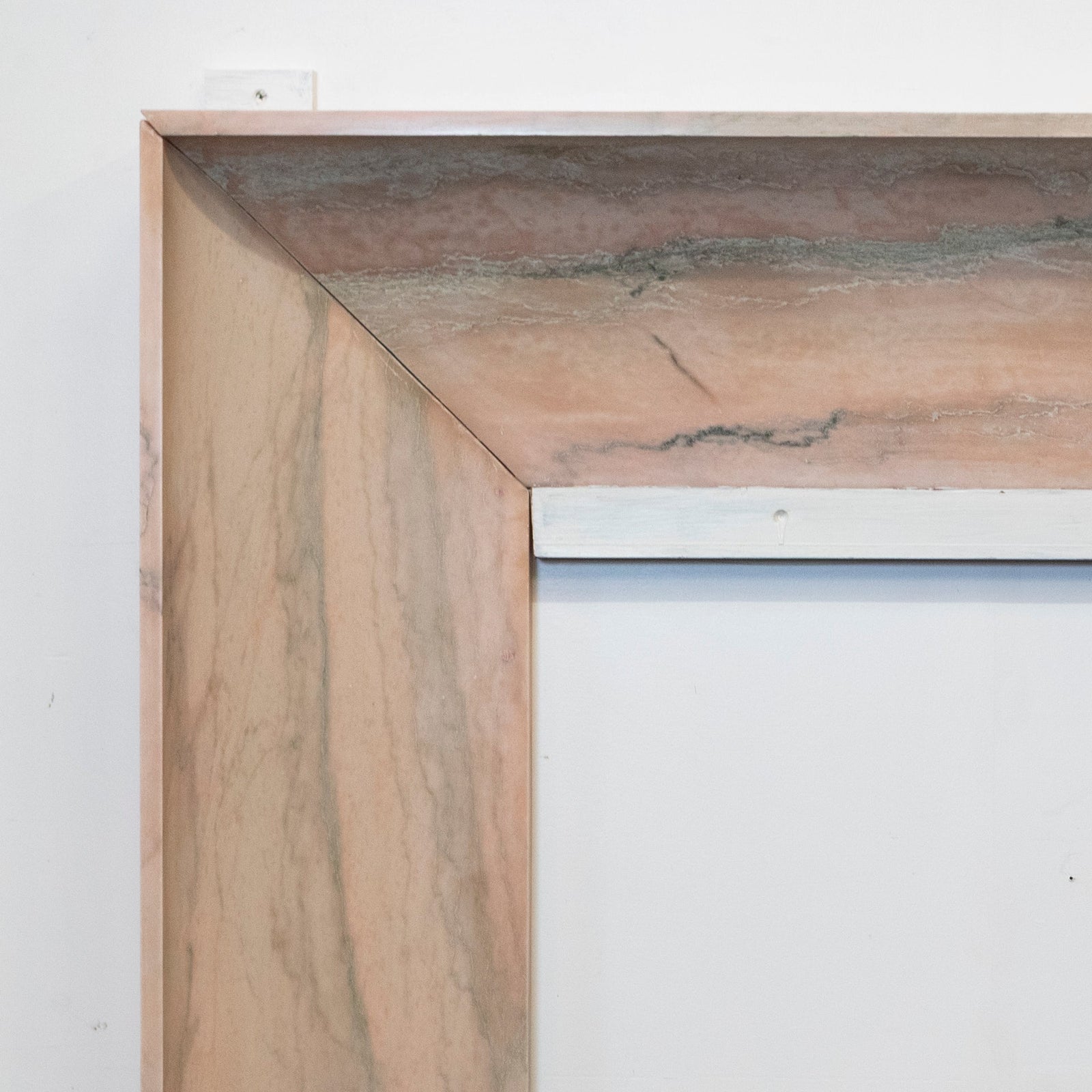 Bolection Fireplace Surround in Reclaimed Pink Marble | The Architectural Forum
