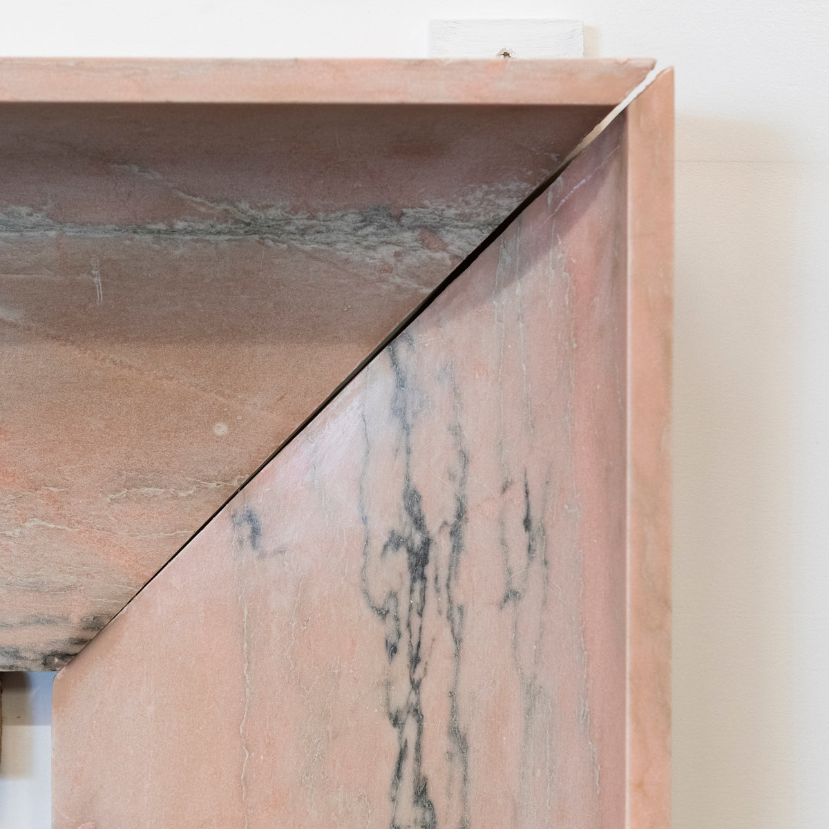 Bolection Fireplace Surround in Reclaimed Pink Marble | The Architectural Forum