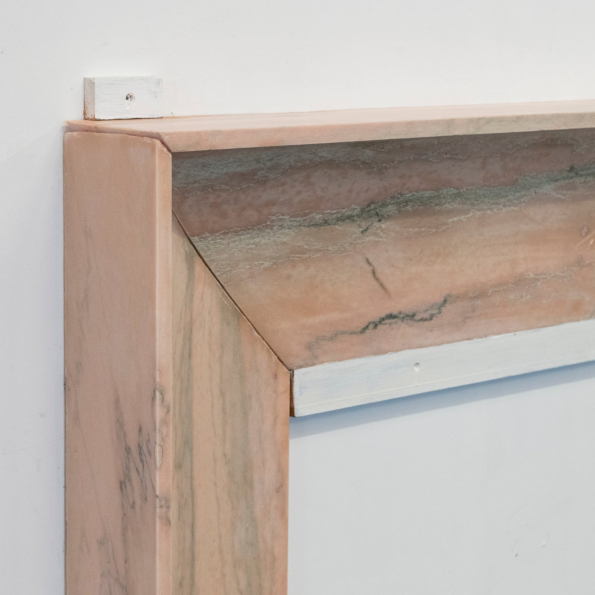 Bolection Fireplace Surround in Reclaimed Pink Marble | The Architectural Forum