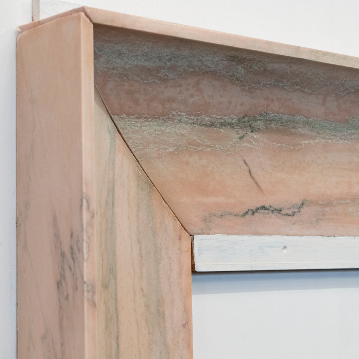 Bolection Fireplace Surround in Reclaimed Pink Marble | The Architectural Forum