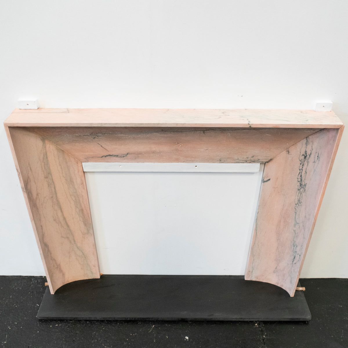 Bolection Fireplace Surround in Reclaimed Pink Marble | The Architectural Forum