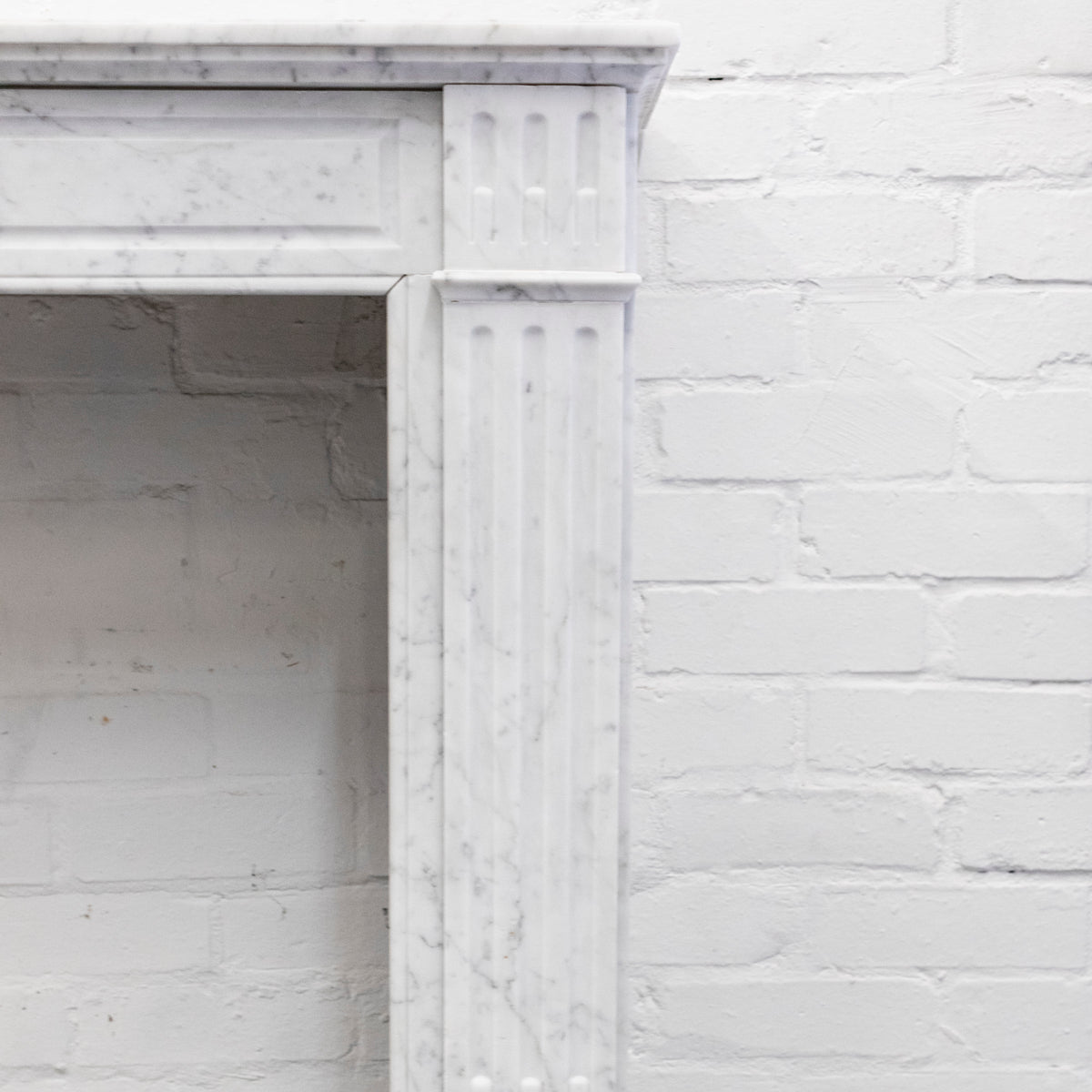 Reclaimed Louis XVI Style Carved Marble Fireplace in Carrara Marble | The Architectural Forum