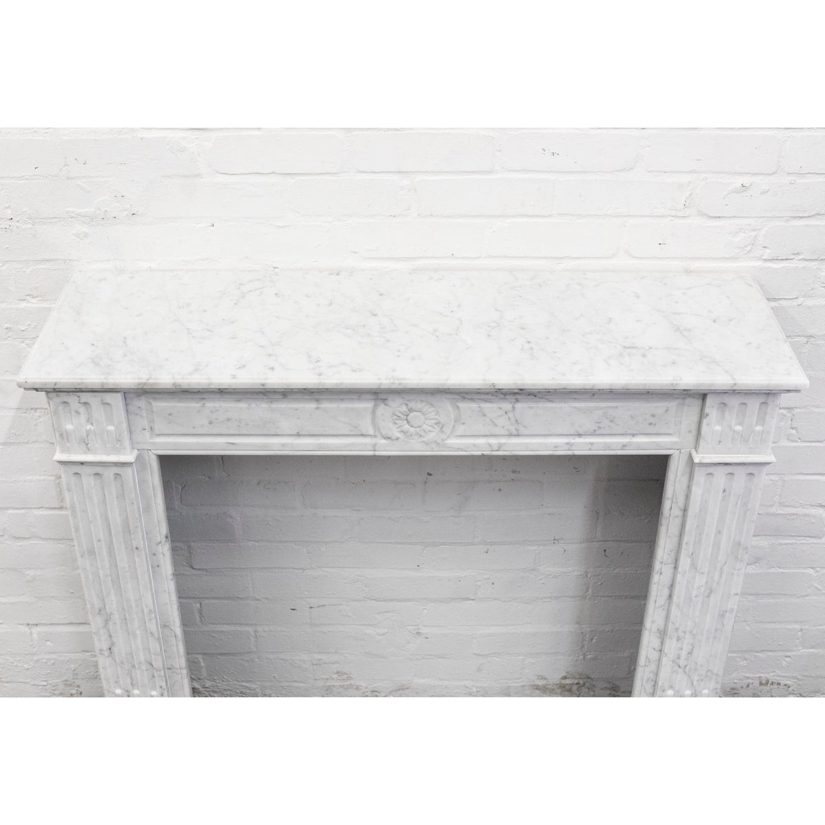Reclaimed Louis XVI Style Carved Marble Fireplace in Carrara Marble | The Architectural Forum
