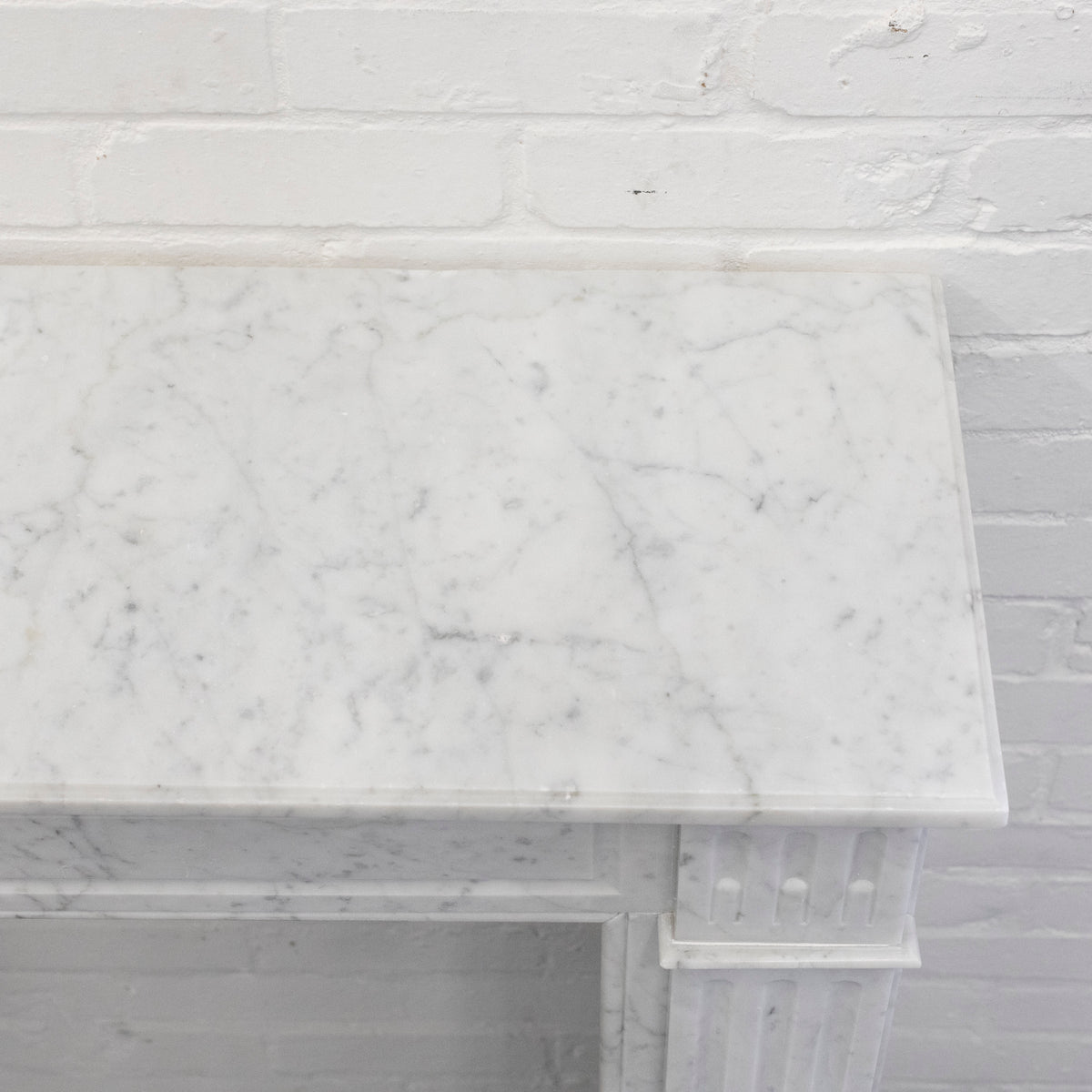Reclaimed Louis XVI Style Carved Marble Fireplace in Carrara Marble | The Architectural Forum