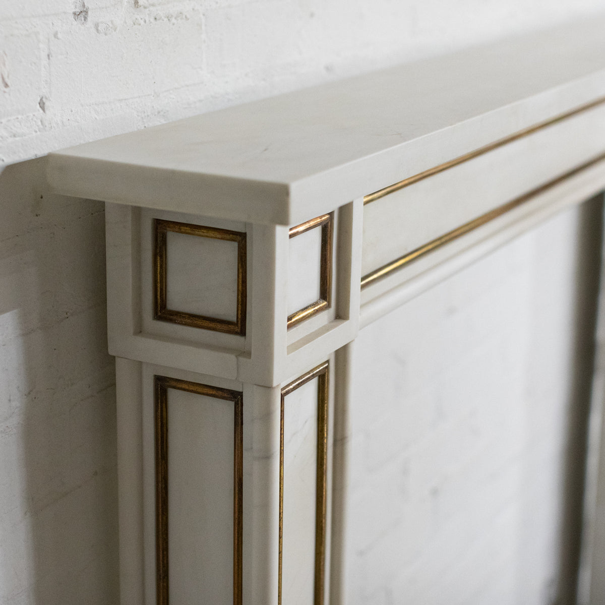 Reclaimed Statuary Marble Fireplace Surround with Brass Detail | The Architectural Forum