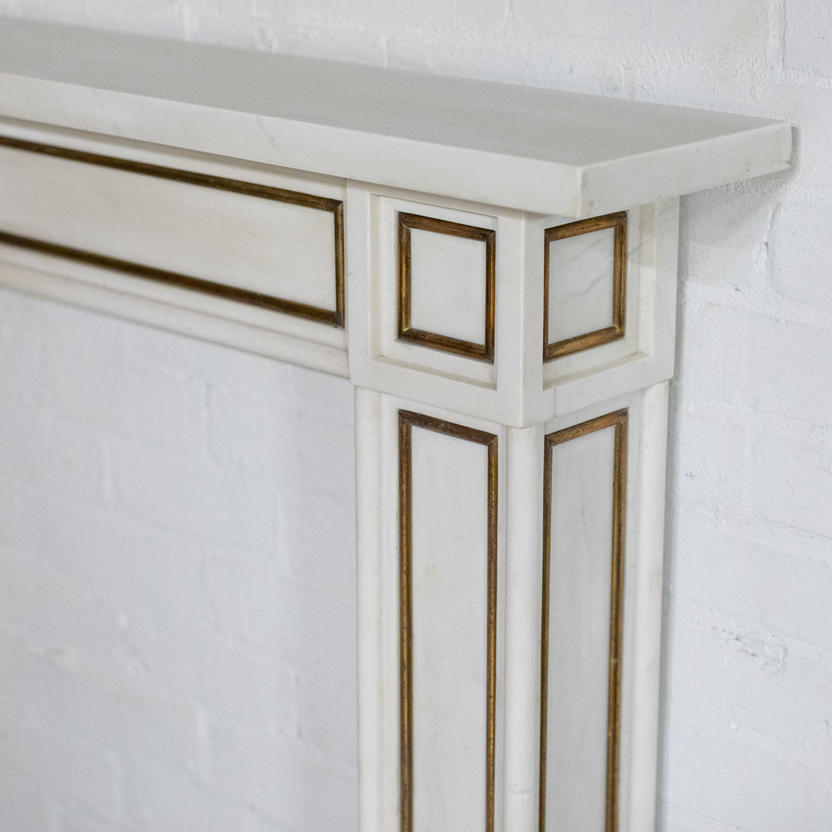 Reclaimed Statuary Marble Fireplace Surround with Brass Detail | The Architectural Forum