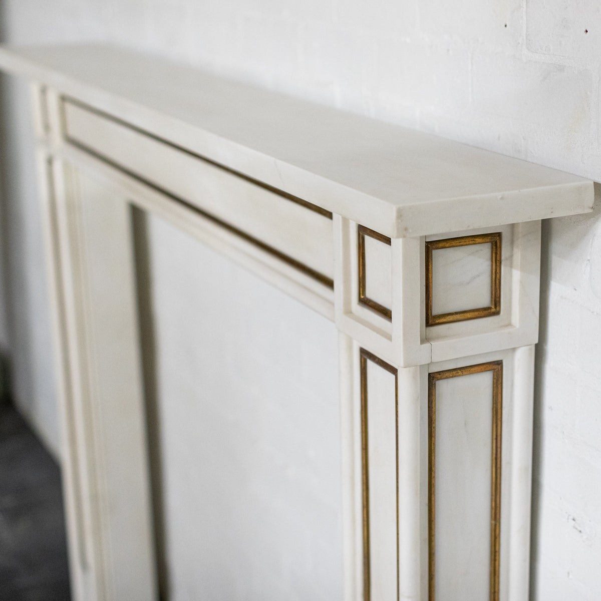 Reclaimed Statuary Marble Fireplace Surround with Brass Detail | The Architectural Forum