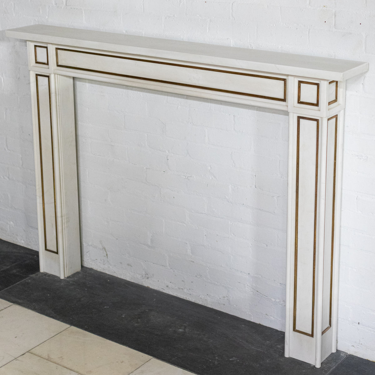 Reclaimed Statuary Marble Fireplace Surround with Brass Detail | The Architectural Forum